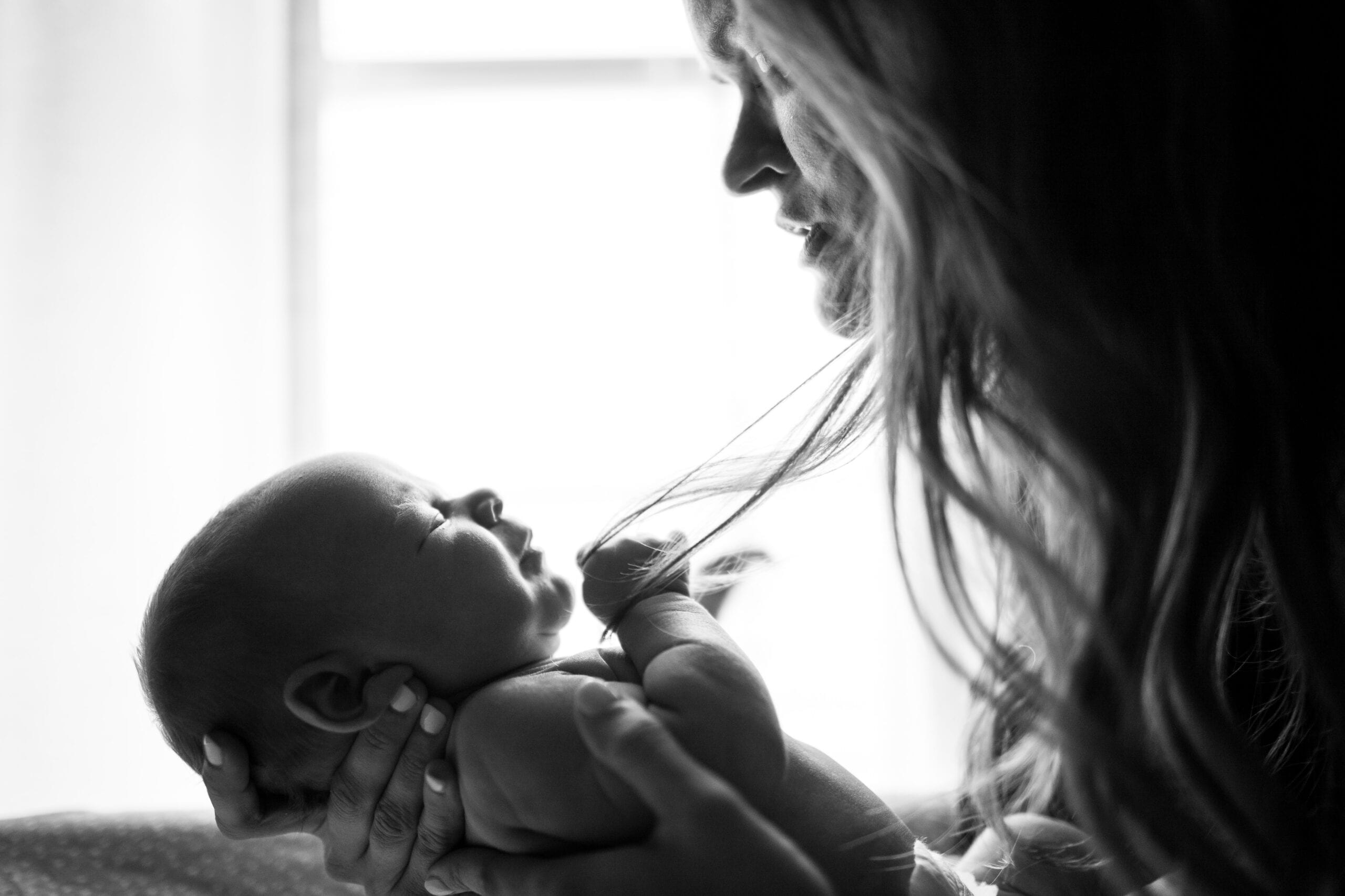 black and white photo of mother and baby