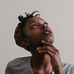 woman looking up thinking